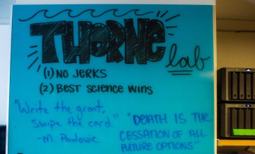 Blue Thorne Lab sign that says no jerks and best science wins.